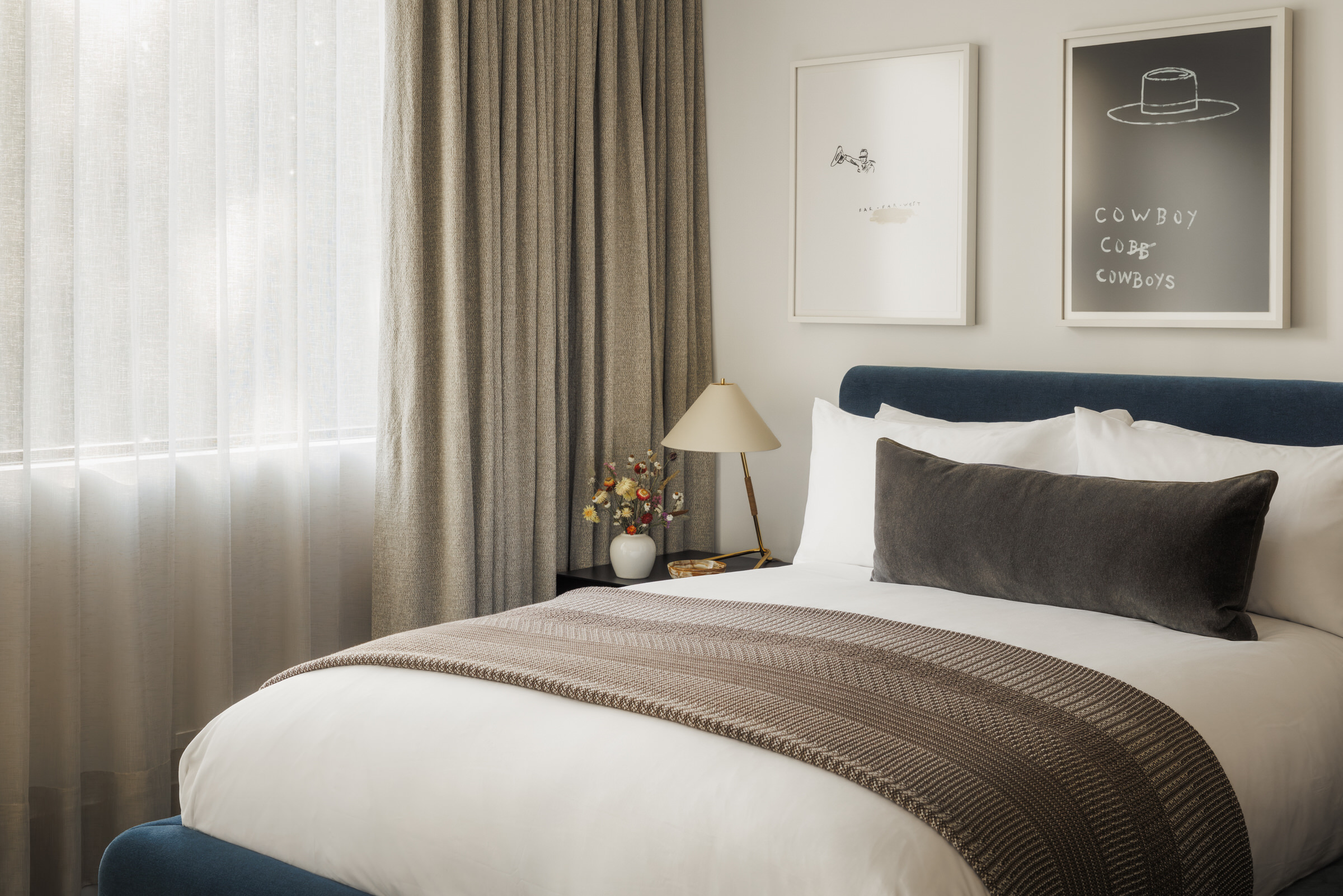 Moonlight Basin Residence — guest bedroom with cowboy works